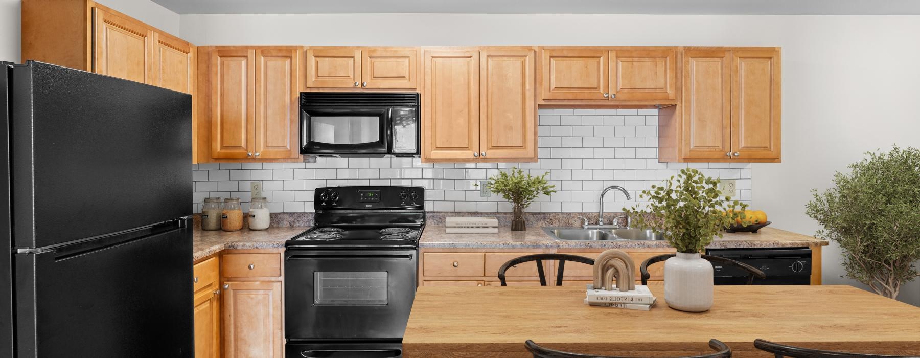 a kitchen with wooden cabinets