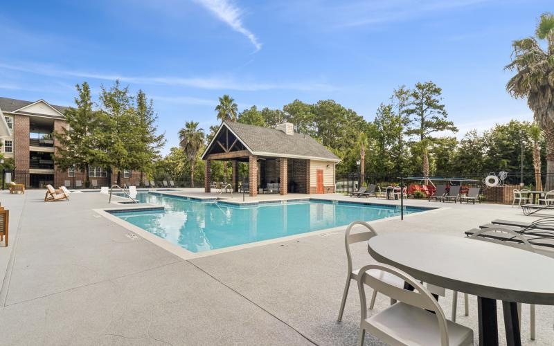 a swimming pool with a building in the background